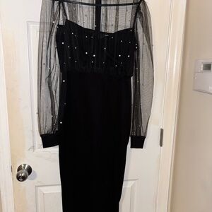 Elegant Black Dress with Sheer Sleeves